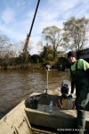 Brian Schilpp navigates his way back from the crane dump site to the westernbank for another load of trash..